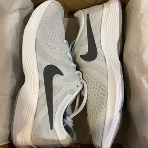 Nike shoes. Size 7Y. Never worn. Smoke free home.